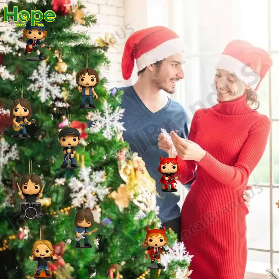 Couple decorating Christmas tree with AC DC character ornaments from the advent calendar.