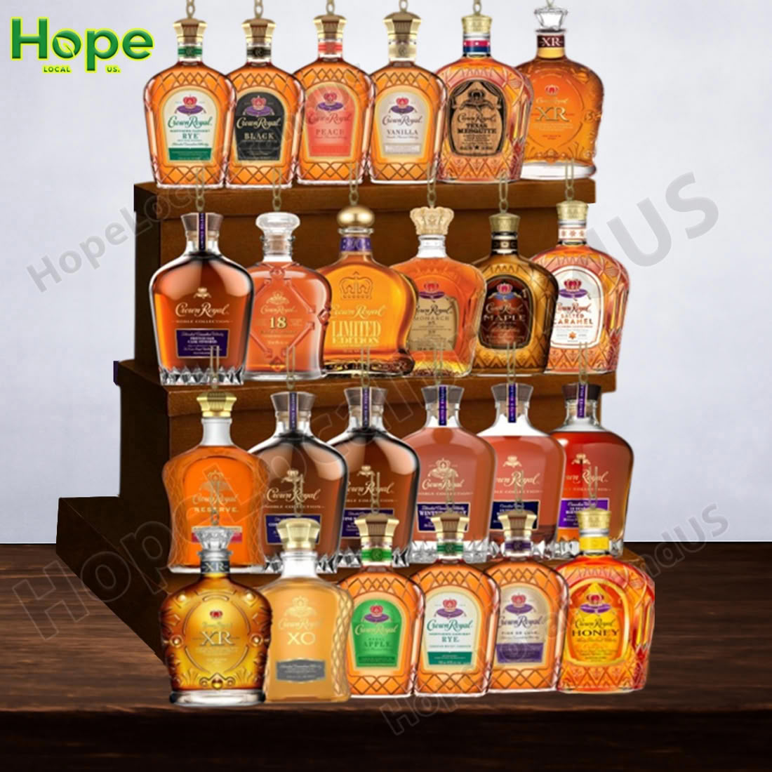 A purple bottle shaped Crown Royal advent calendar sitting on a wooden surface!
