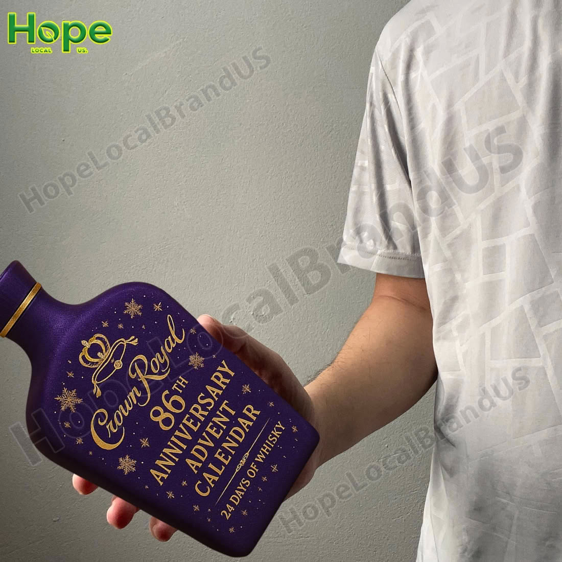 A person holding a large purple whisky bottle shaped advent calendar!