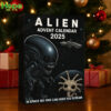 The Alien Advent Calendar 2025 box is set up as a holiday decoration next to a Christmas tree and wrapped presents!
