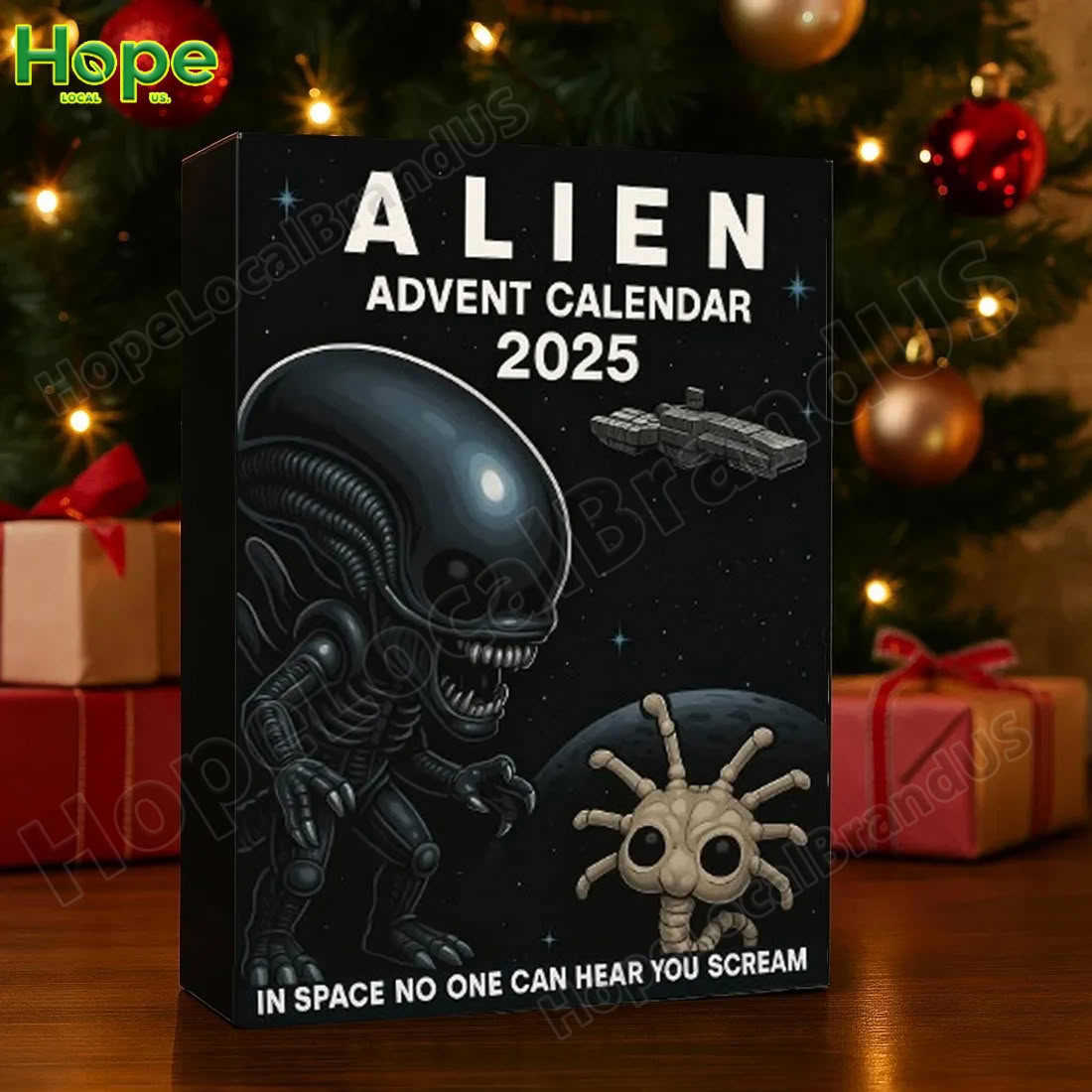 The Alien Advent Calendar 2025 box is set up as a holiday decoration next to a Christmas tree and wrapped presents!