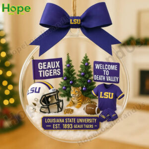 A clear round LSU Tigers holiday ornament with a helmet jersey and tiger figurines inside!