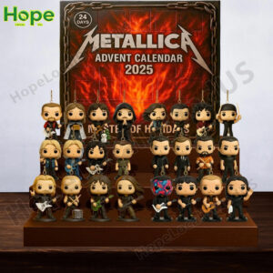 The Metallica Advent Calendar 2025 box and all 24 collectible figures are displayed on a wooden stand with a festive Christmas lights background!