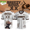 A white and brown v neck jersey for the Kansas City Chiefs in collaboration with Chris Brown showing the front and back views!