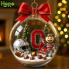 An Ohio State Buckeyes snow globe ornament features the Brutus mascot a helmet and the O logo inside a clear ball!