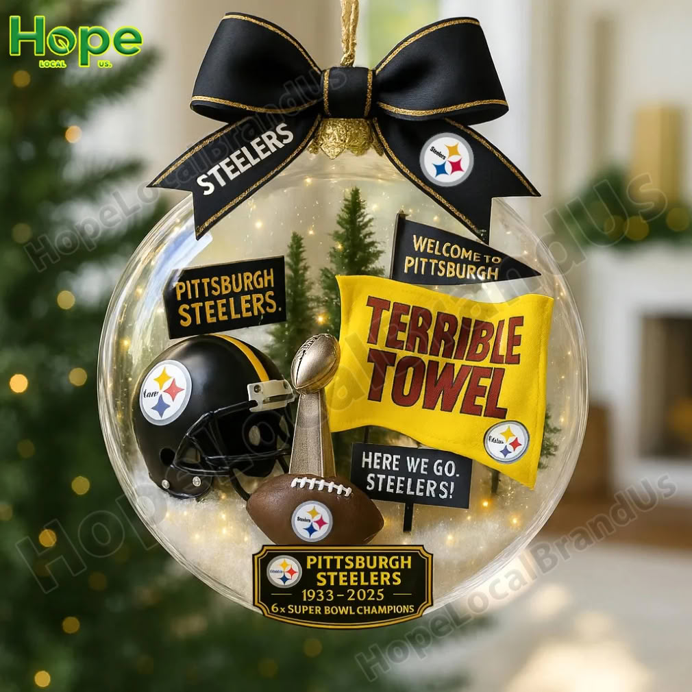 A Pittsburgh Steelers anniversary ornament contains a helmet a trophy and a yellow Terrible Towel inside a clear globe!