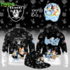 A black hoodie featuring the Las Vegas Raiders logo on the front and Bluey and Bingo running with a football on the back.
