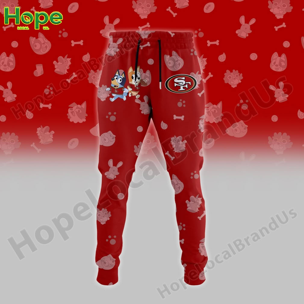 Red joggers with a San Francisco 49ers logo on one leg and Bluey and Bingo characters on the other!