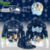 A collection of Seattle Seahawks and Bluey crossover apparel including a navy blue hoodie and a matching cap!