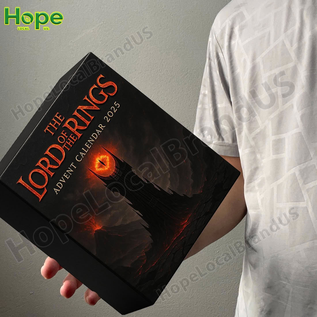 A person is holding the black Lord of the Rings Advent Calendar box that features the Tower of Barad dur and the Eye of Sauron!